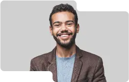 Enthusiastic young male team member with a friendly demeanor, wearing a brown blazer and light blue sweater, showcasing the dynamic and approachable team culture of our cryptocurrency exchange.